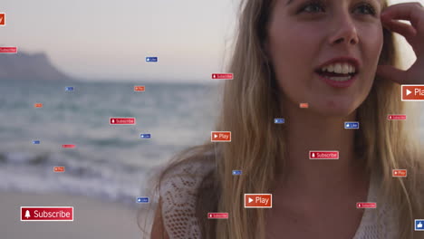 Social-media-engagement-buttons-animation-over-woman-standing-on-beach