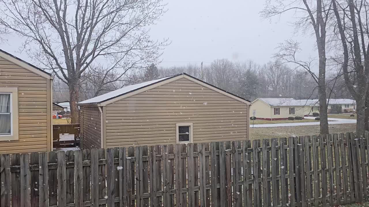 Light Snow Falling on a Residential Neighborhood