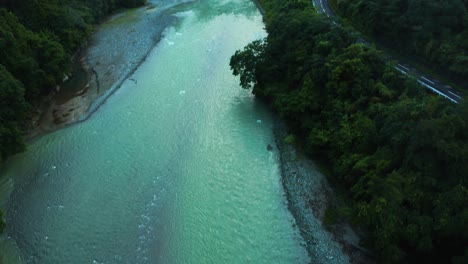aerial tilt as car passing over old valley bridge in shikoku japan