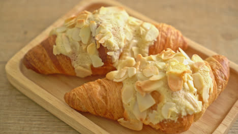 croissant with cream and almonds