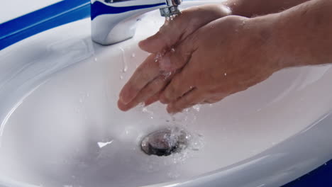 hands washing with splashing water