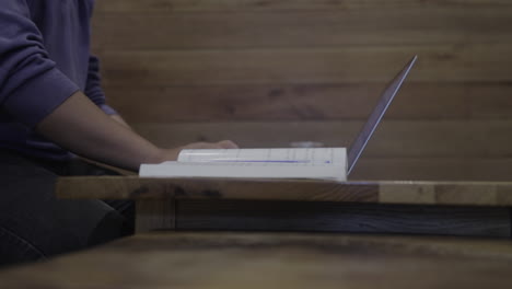 person working on laptop in cafe