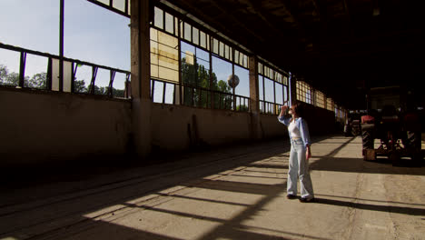 woman walking in an abandoned industrial building