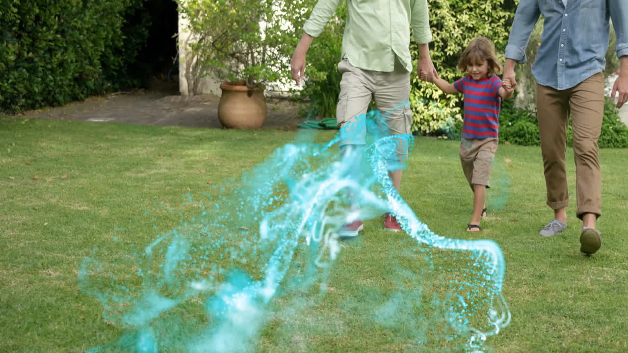 grandfather and father swinging boy on lawn, illustrating technology with digital particle swirl