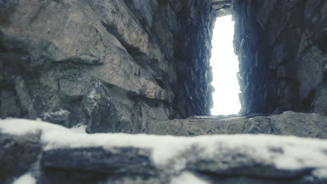 old castle loophole from inside a ruined castel