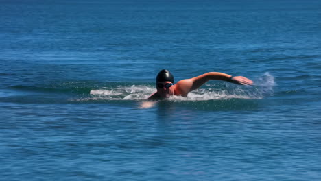 person swimming in the ocean