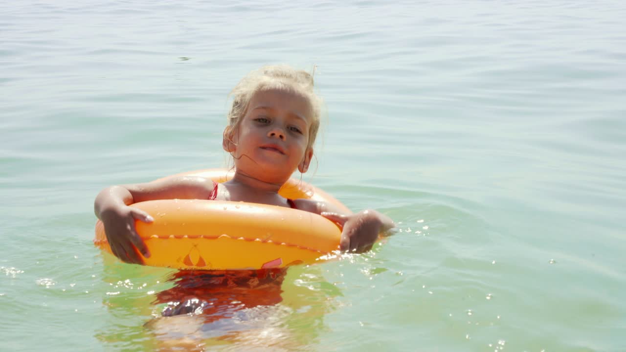 Child swims sea inflatable ring. danger of drowning Safety equipment, Child Life buoy