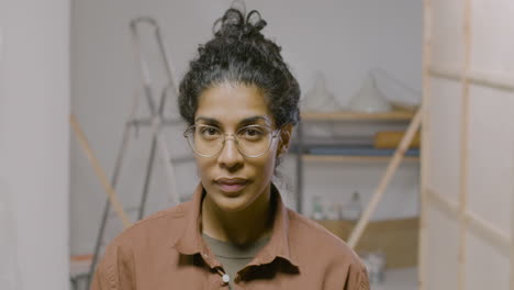 woman with glasses posing