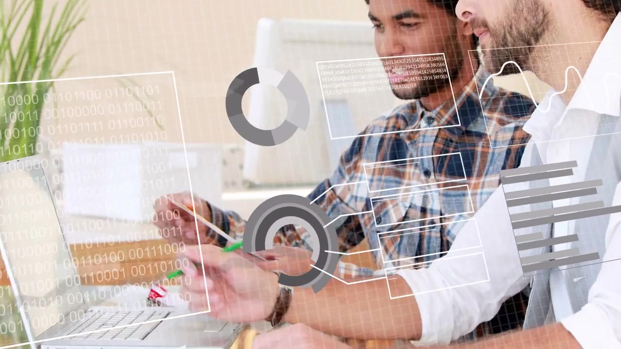 Man in plaid shirt presenting swatch fan, coworker taking notes, HUD charts guiding design choice