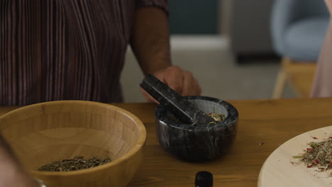 preparing ayurvedic herbs