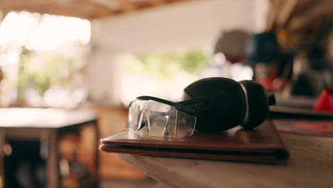 goggles, table and carpentry tools in closeup