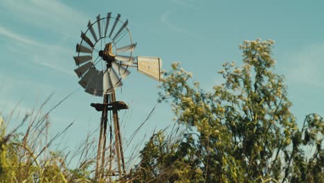 Wind-turbine-rotating-in-the-wind-on-farmland-in-Agentina