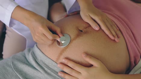 pregnant woman and gynecologist doctor at hospital