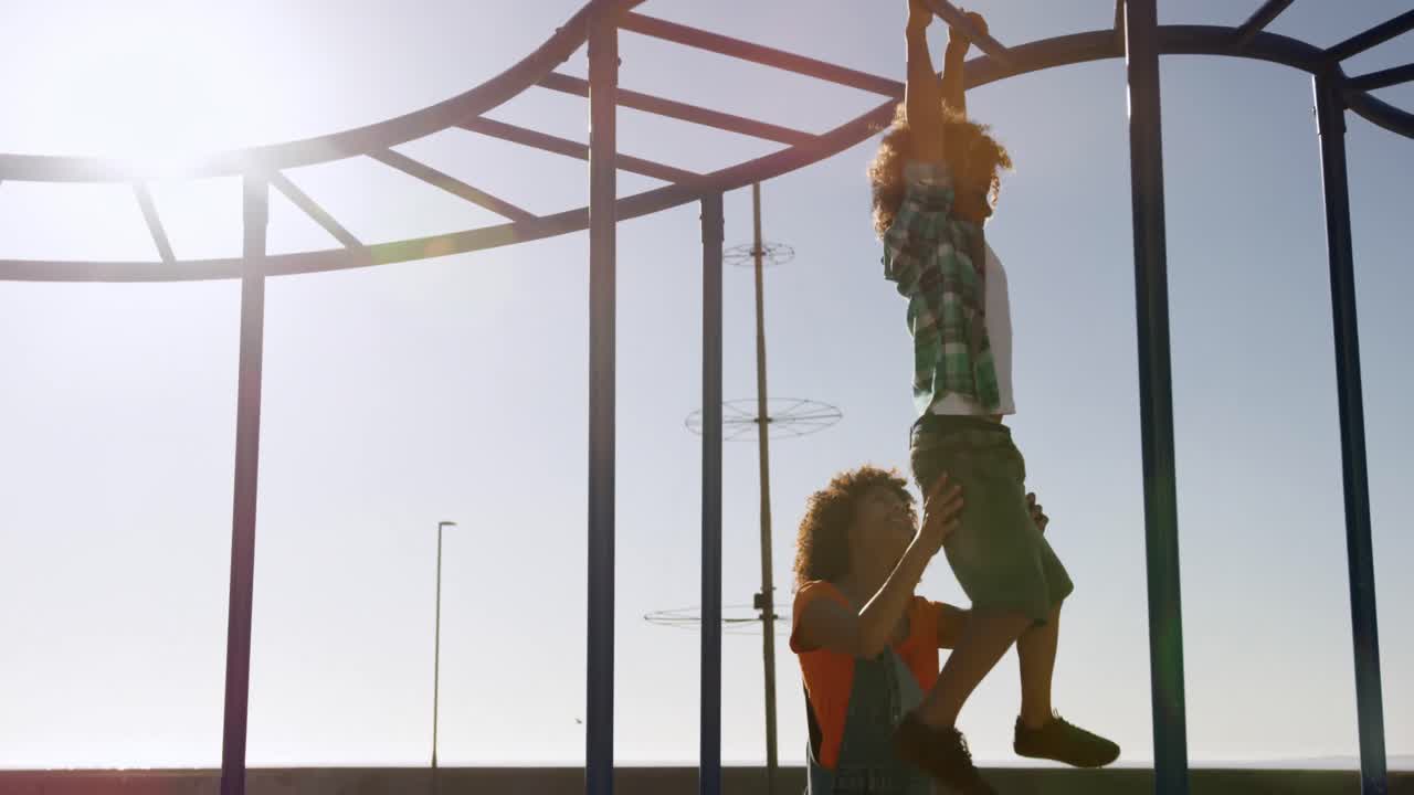Mother and son having fun at playground