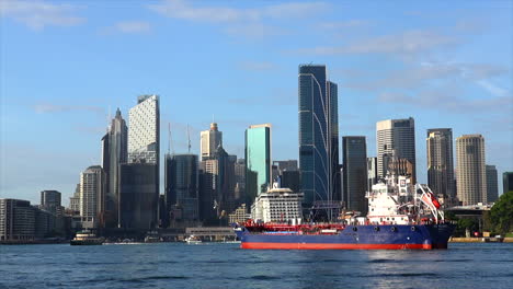 a fuel tanker ship approaches circular quay to refuel a cruise ship in sydney harbour australia
