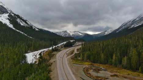 Scenic-Highway-surrounded-by-trees-and-mountain-landscape