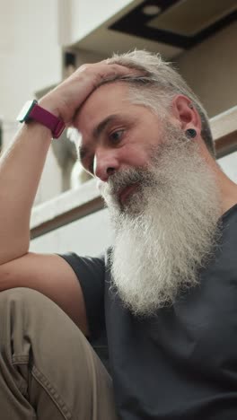 a man looks thoughtful and serious