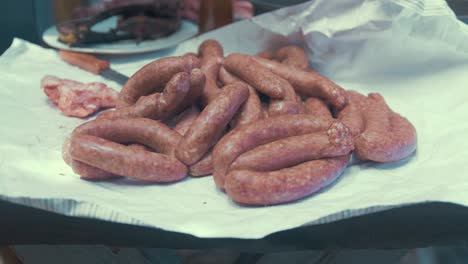 Sausages-prepared-on-table-ready-to-be-cooked-on-barbeque