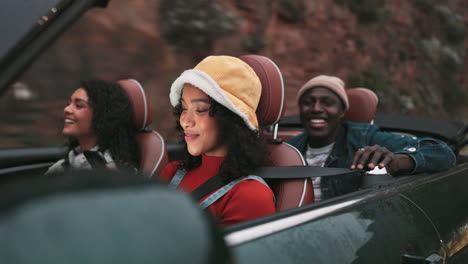friends enjoying a convertible road trip