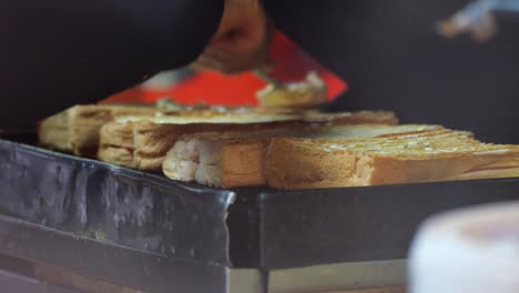 making toasts or grilled sandwiches on a griddle