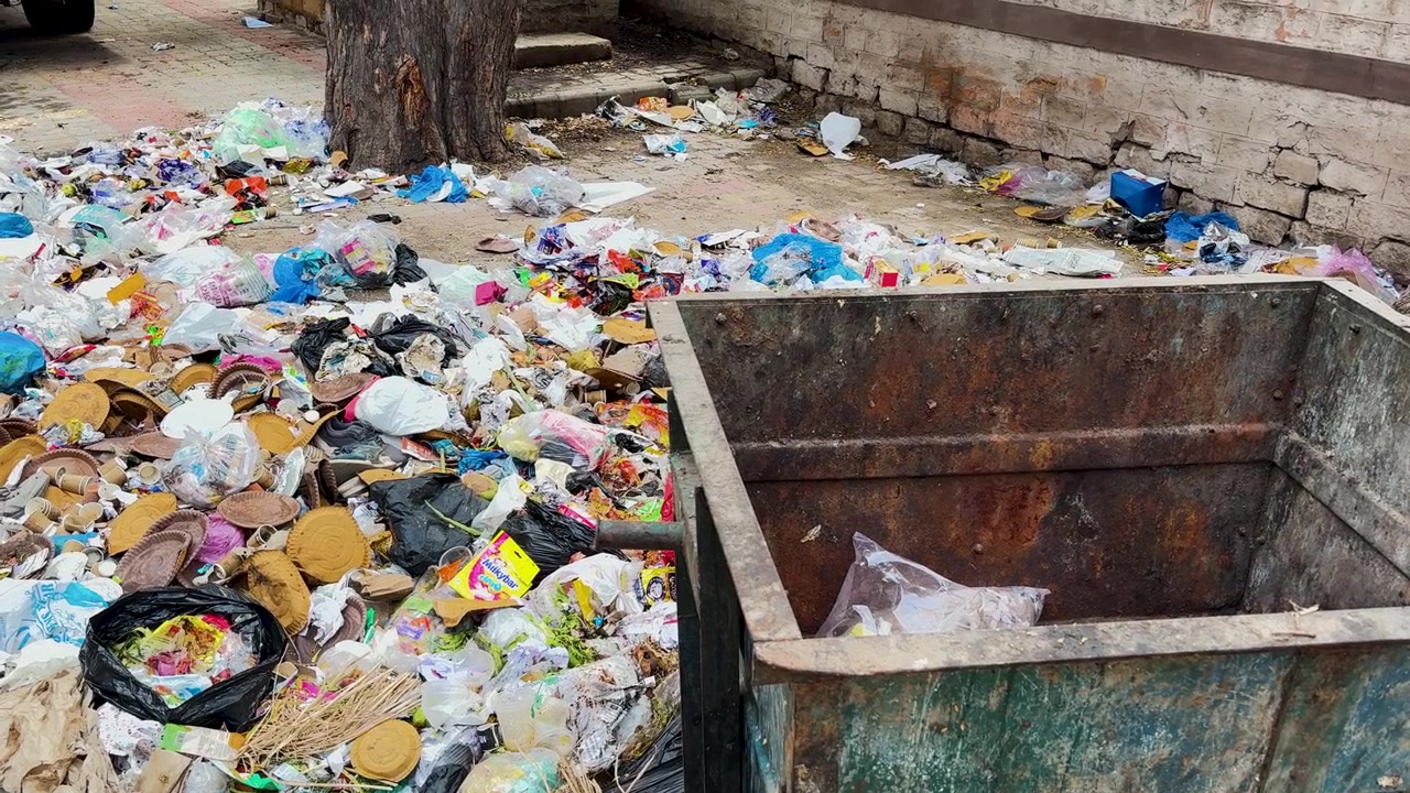 Dumped Garbage Outside Waste Container Highlighting Urban Civic Sense And Cleanliness