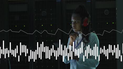animation of data processing over african american female it engineer and computer servers