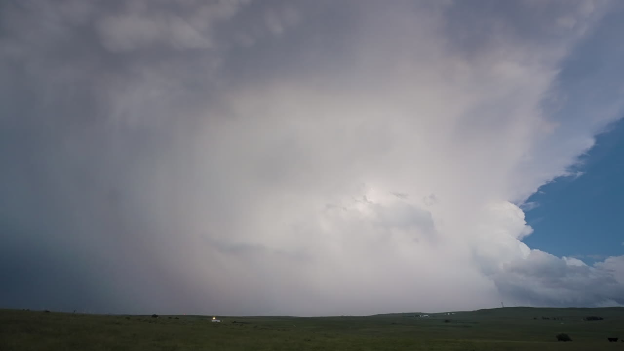 Lightning Show As Towering Storm Drifts Away In Soft Twilight