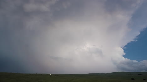 lightning show as towering storm drifts away in soft twilight
