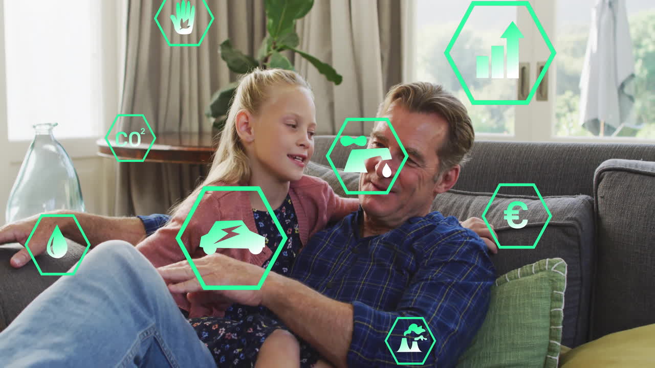 Grandfather and granddaughter connecting over environmental icons floating above sofa