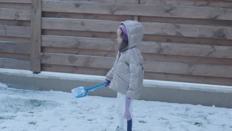 grandfather and granddaughter having fun in the snow