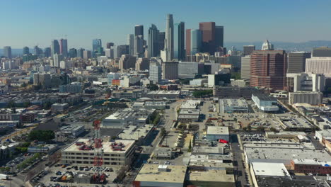 Aerial-decent-of-the-DTLA-Skyline-on-a-bright-blue-day-in-California-USA