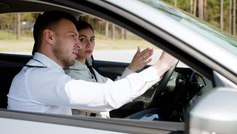 driving school teacher with student