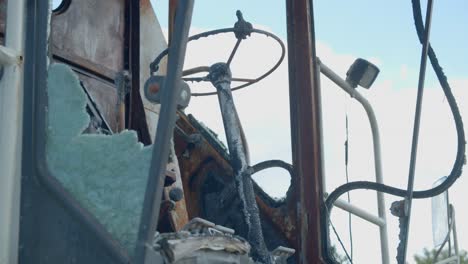 Broken-Glass-Windshield-Of-A-Damaged-Combine-Harvester-Tractor