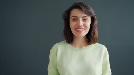 woman waving and smiling