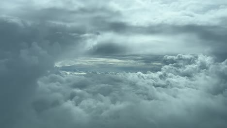 pilot point of view from a jet cockpit flying through a gap in a turbulent winter sky