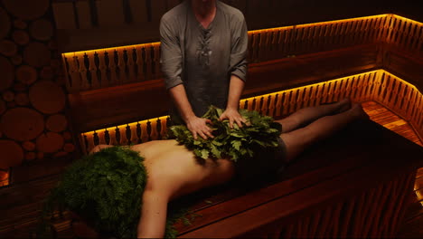 man receiving a traditional sauna treatment
