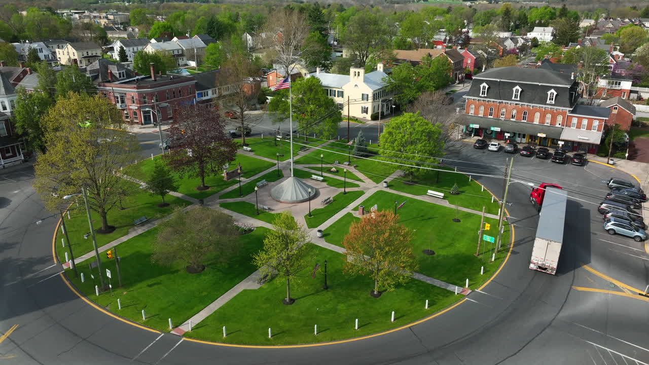 American flag proudly waves in small town in USA