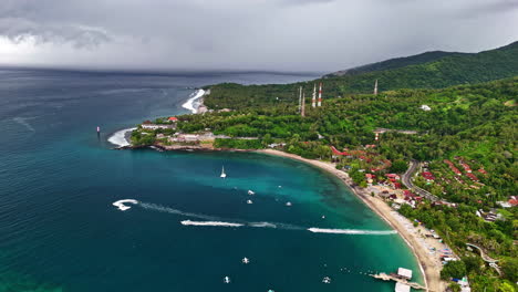 aerial view of the bay at senggigi beach as storm clouds approach in the sky