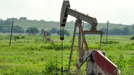 oil well drilling for crude fossil fuels in rural field in america