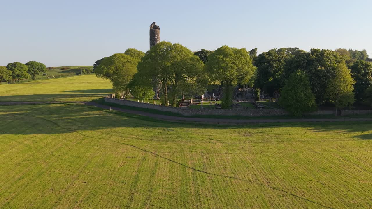 Historic Monasterboice ruins in scenic green fields of County Louth, Ireland