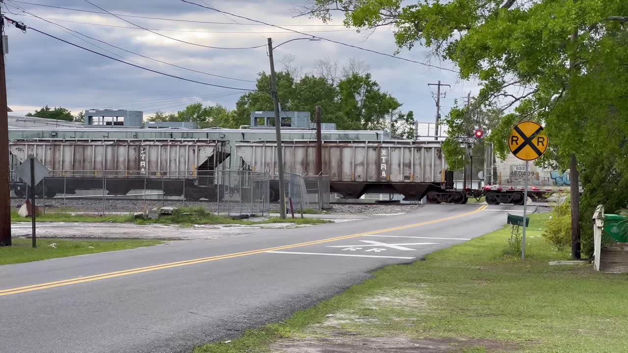 Freight train railroad crossing with flashing red signal lights, Atlanta, Georgia