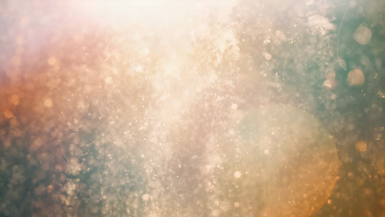 Svävande, upplyst partikelmoln som glittrar i närbild, pulserande bakgrundsbelysning skapar turkost bokeh.
