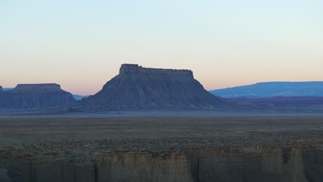 wild nature of factory butte at sunset in utah, usa