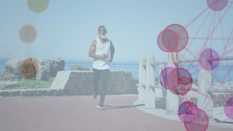 Animation-of-network-of-connections-over-senior-african-american-man-running-at-beach