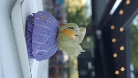 purple pastry with cape gooseberry