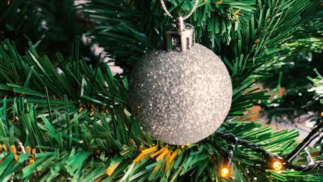 round christmas bulb decorations on spruce branch tree