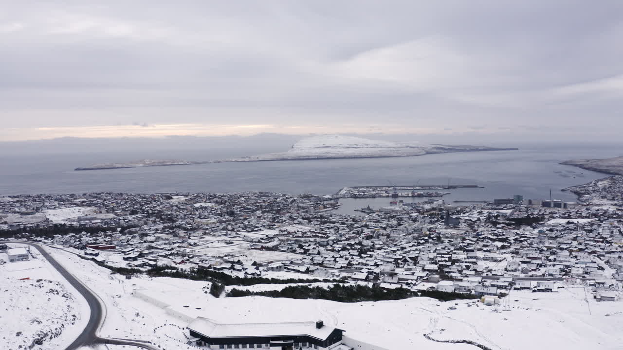 4K Wide Push In of T&oacute;rshavn town covered in Snow, Faroe Islands