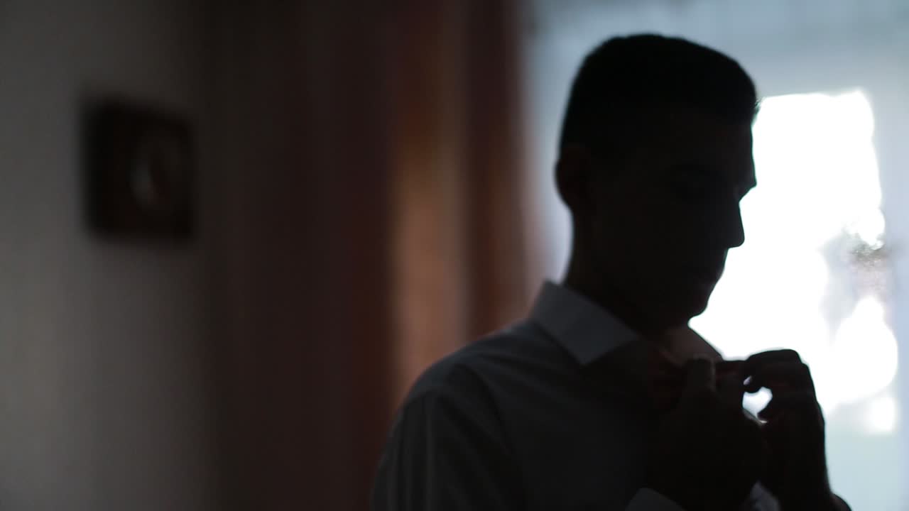 Grooms Morning Preparation. Happy groom getting ready in the morning for wedding ceremony