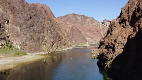 Aerial-drone-view-over-canoes-on-a-river-in-middle-of-mountains,-in-Arizona,-USA