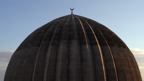 the camera zooms out from the metal moon on one of the domes of the zinciriye madrasa and sees the entire dome